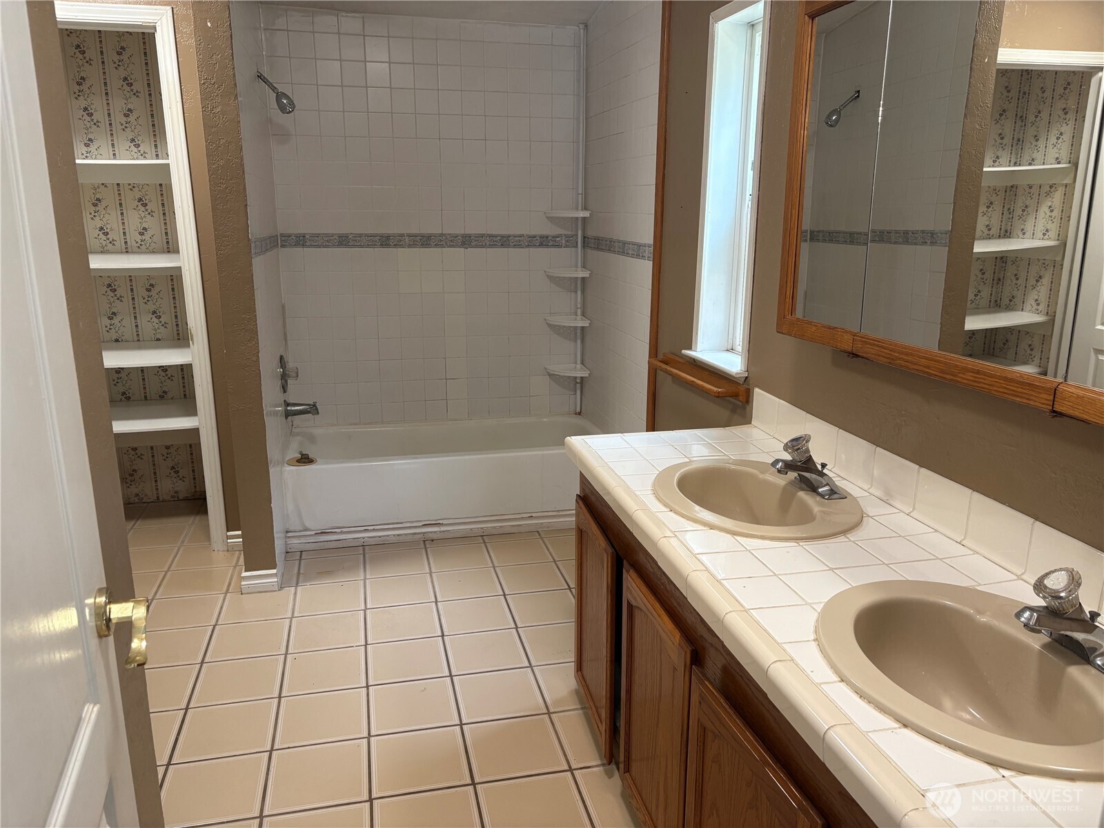 17411 64th St Court Northwest Vaughn, WA 98394 - Photo 19 of 27 a bathroom with a sink a vanity and a mirror