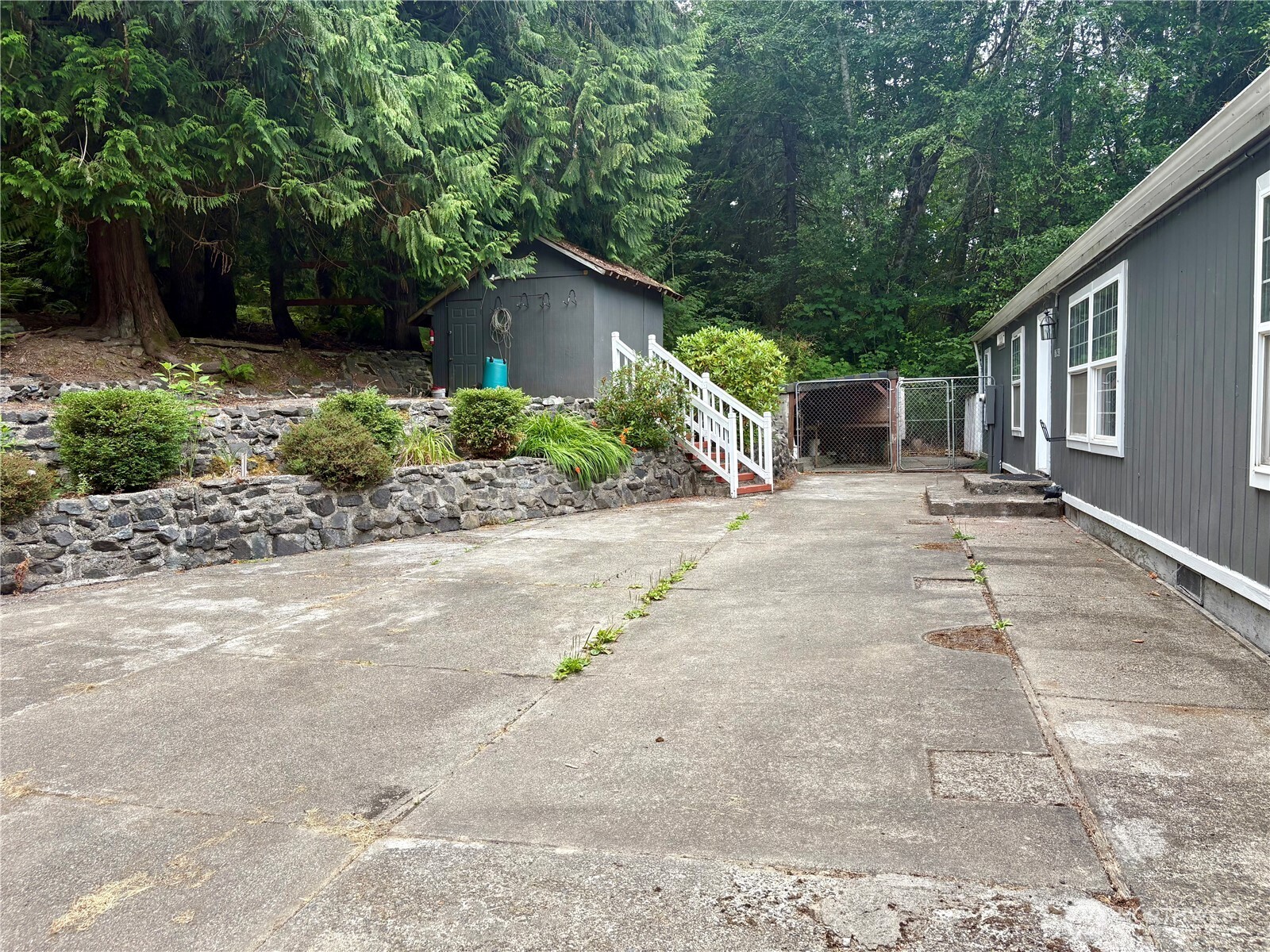 17411 64th St Court Northwest Vaughn, WA 98394 - Photo 23 of 27 a front view of a house with garden