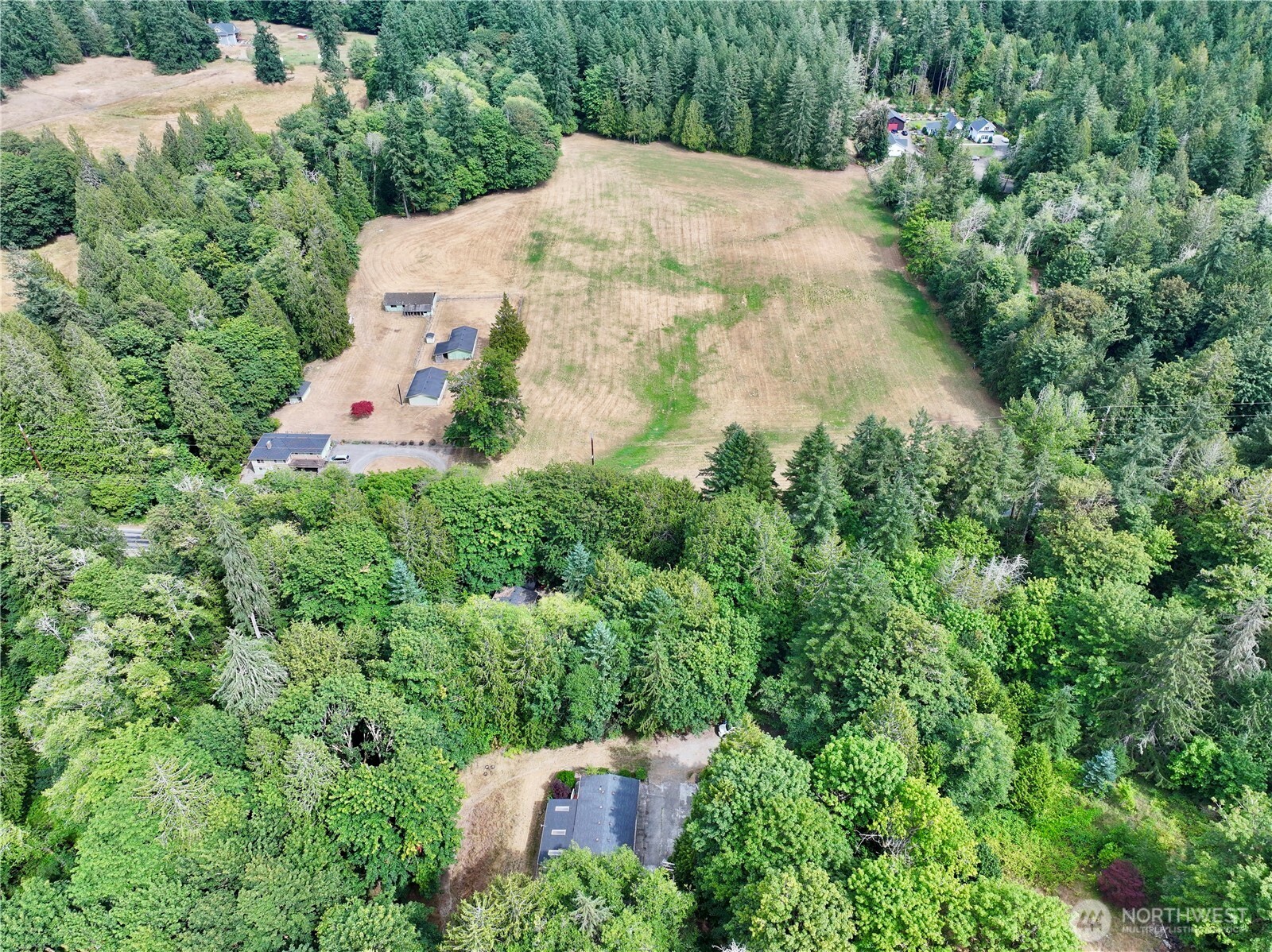 17411 64th St Court Northwest Vaughn, WA 98394 - Photo 3 of 27 an aerial view of a house with a yard