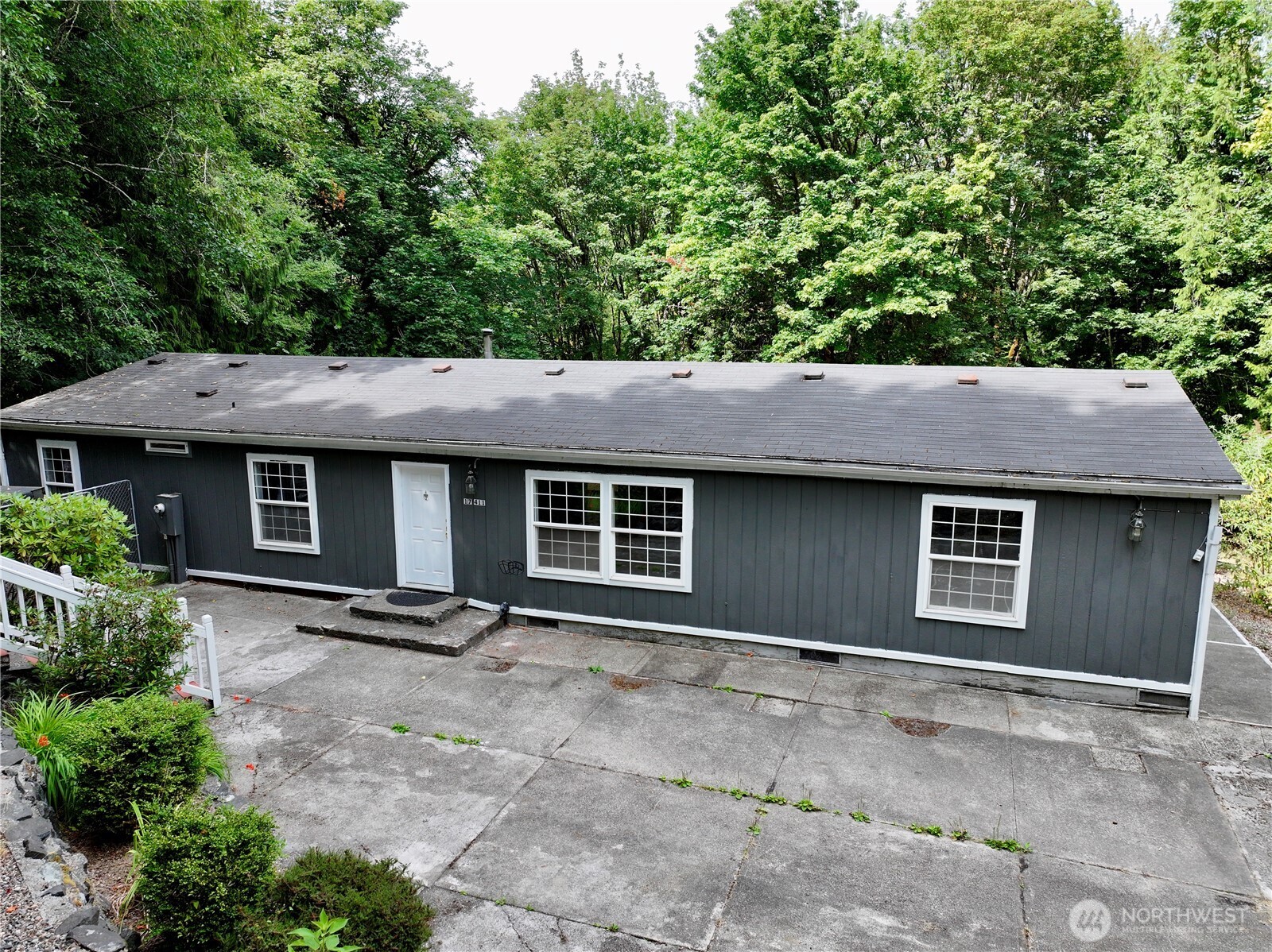 17411 64th St Court Northwest Vaughn, WA 98394 - Photo 5 of 27 a backyard of a house with lots of green space