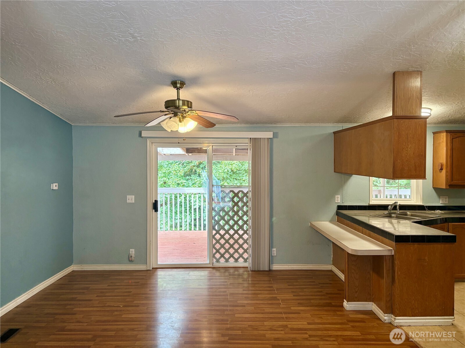 17411 64th St Court Northwest Vaughn, WA 98394 - Photo 9 of 27 a view of kitchen with wooden floor