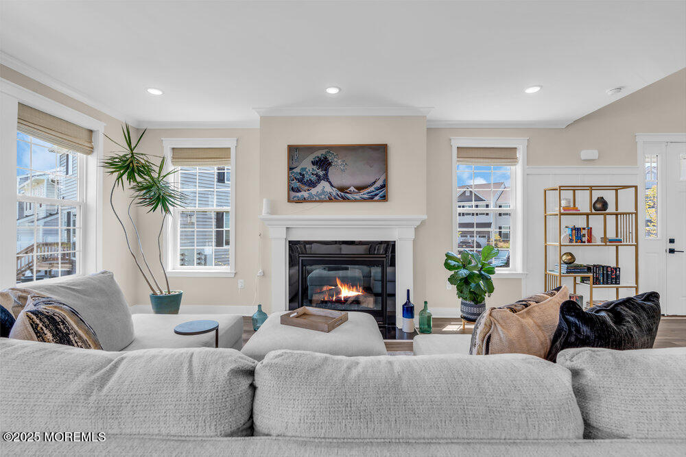 3028 Quail Rdg Boulevard, Unit 606 Farmingdale, NJ 07727 - Photo 11 of 82 a living room with furniture large window and a fireplace
