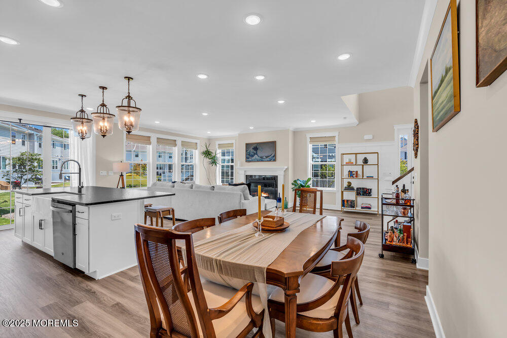3028 Quail Rdg Boulevard, Unit 606 Farmingdale, NJ 07727 - Photo 21 of 82 a open dining room with stainless steel appliances kitchen island a table and chairs