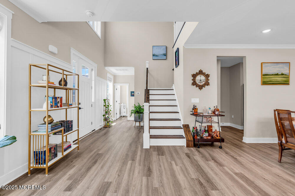 3028 Quail Rdg Boulevard, Unit 606 Farmingdale, NJ 07727 - Photo 23 of 82 a view of a livingroom with furniture and staircase