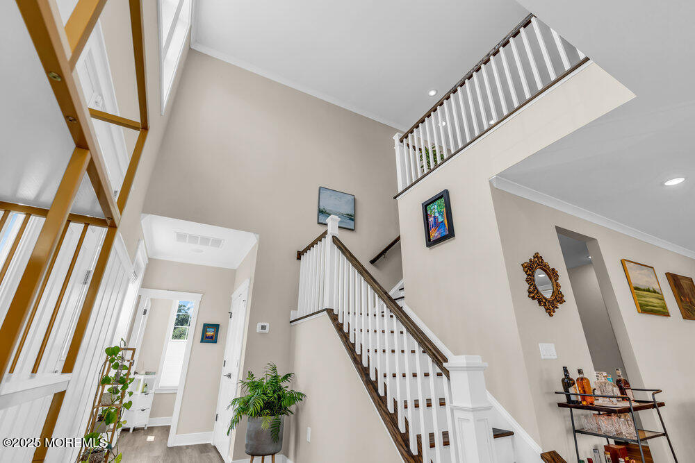 3028 Quail Rdg Boulevard, Unit 606 Farmingdale, NJ 07727 - Photo 24 of 82 a view of staircase with furniture and front door