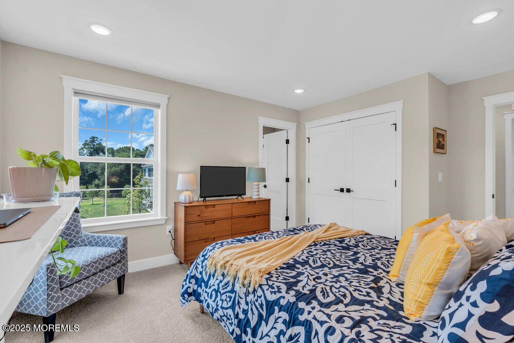 3028 Quail Rdg Boulevard, Unit 606 Farmingdale, NJ 07727 - Photo 40 of 82 a bedroom with a bed and a couch