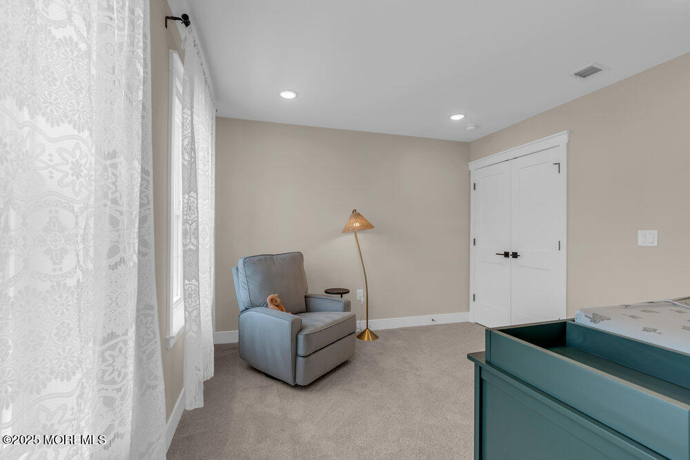 3028 Quail Rdg Boulevard, Unit 606 Farmingdale, NJ 07727 - Photo 42 of 82 a living room with furniture and a ceiling fan
