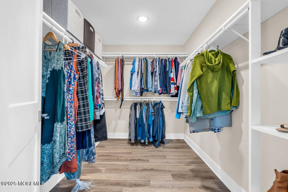3028 Quail Rdg Boulevard, Unit 606 Farmingdale, NJ 07727 - Photo 50 of 82 a view of walk in closet with clothes