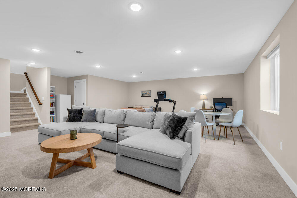 3028 Quail Rdg Boulevard, Unit 606 Farmingdale, NJ 07727 - Photo 54 of 82 a living room with furniture and a potted plant