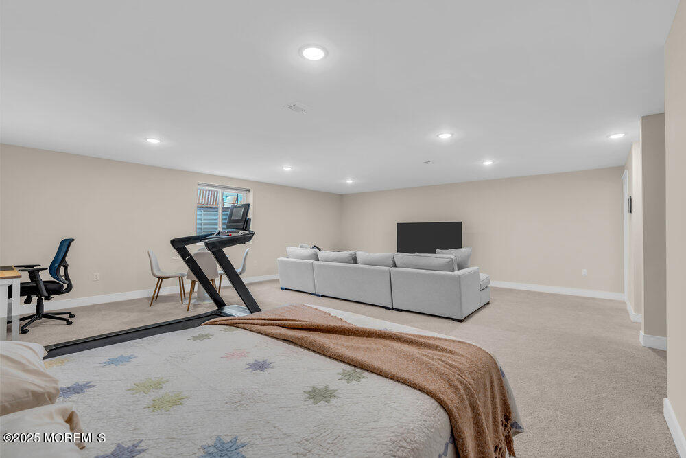 3028 Quail Rdg Boulevard, Unit 606 Farmingdale, NJ 07727 - Photo 56 of 82 a living room with furniture and a flat screen tv