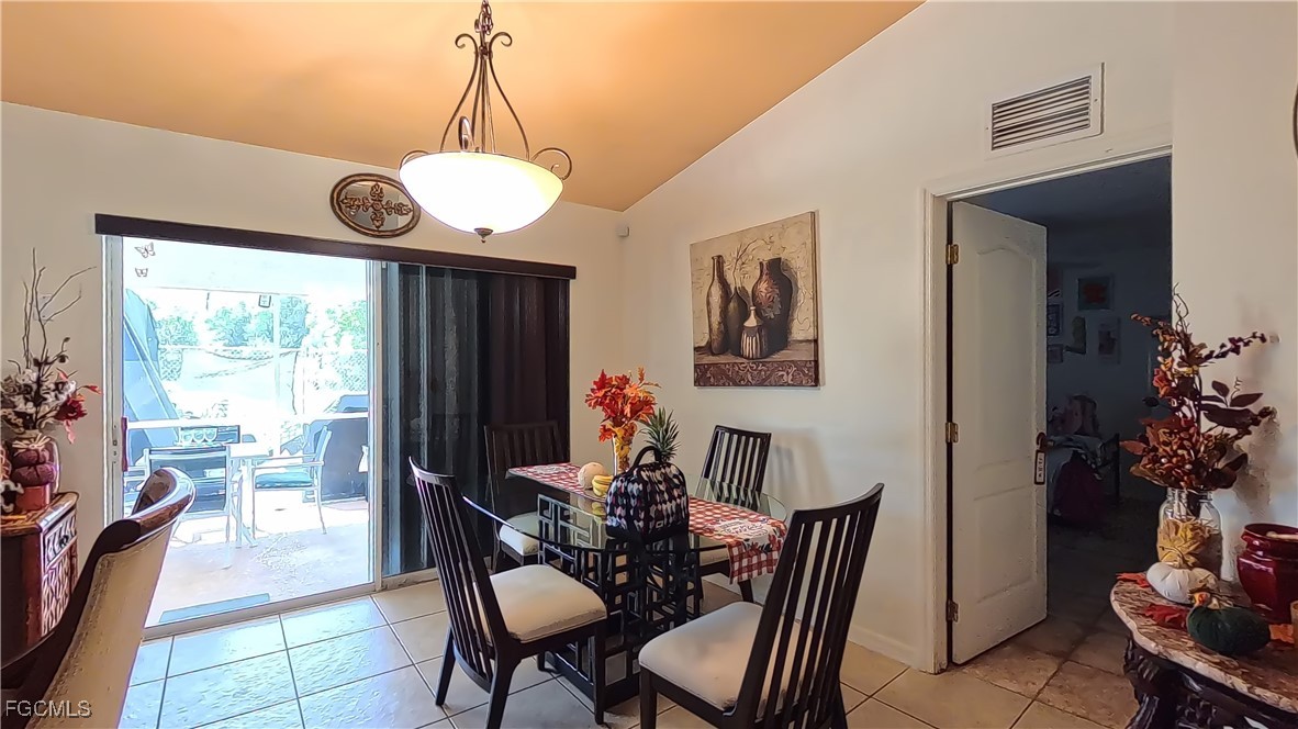3003 25th Street West Lehigh Acres, FL 33971 - Photo 20 of 25 a view of a dining room with furniture window and wooden floor
