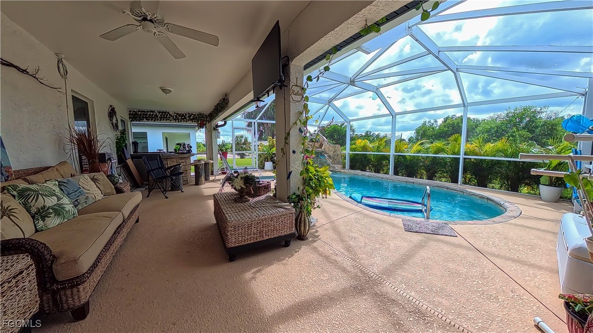 3003 25th Street West Lehigh Acres, FL 33971 - Photo 22 of 25 a view of a livingroom with furniture and floor to ceiling window