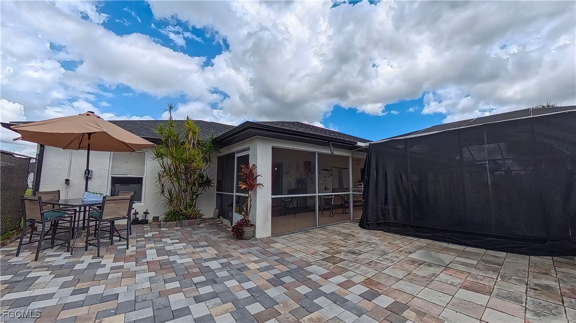 3003 25th Street West Lehigh Acres, FL 33971 - Photo 24 of 25 an outdoor space with patio and white umbrellas