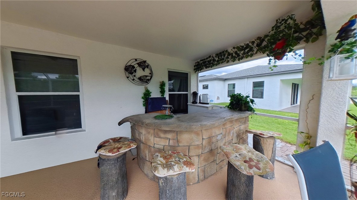 3003 25th Street West Lehigh Acres, FL 33971 - Photo 7 of 25 a dining room with furniture garden view and a potted plant