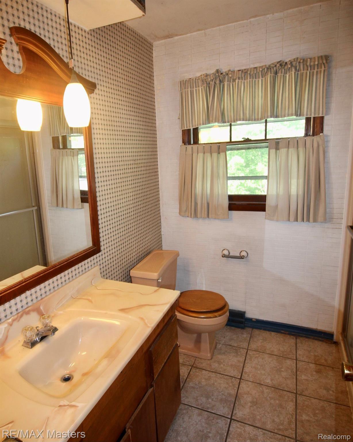 12040 Creek Road Carleton, MI 48117 - Photo 18 of 47 Upstairs bath with long vanity, tile floors and..