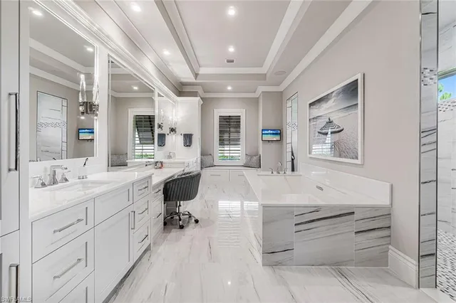 a spacious bathroom with a double vanity sink a mirror and shower
