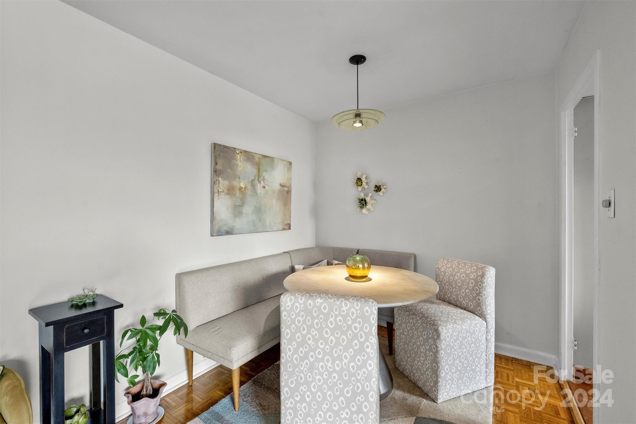 1300 Queens Road, Unit 317 Charlotte, NC 28207 - Photo 15 of 24 a workspace room with furniture and wooden floor