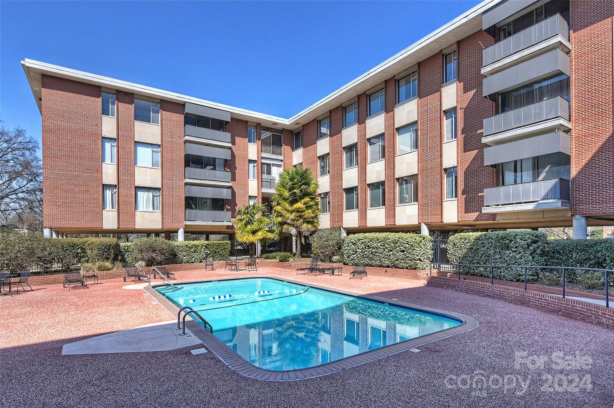 1300 Queens Road, Unit 317 Charlotte, NC 28207 - Photo 18 of 24 a view of a building with a yard