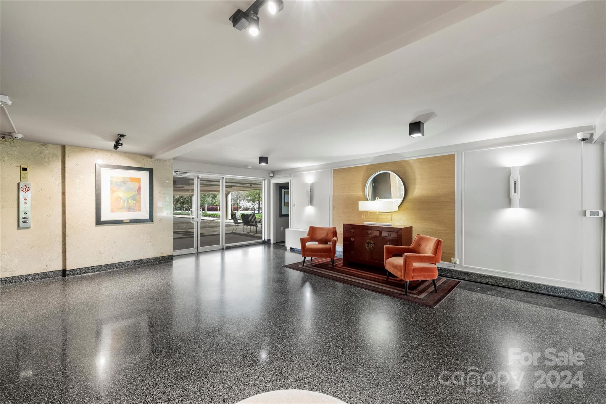 1300 Queens Road, Unit 317 Charlotte, NC 28207 - Photo 23 of 24 a living room with furniture and wooden floor