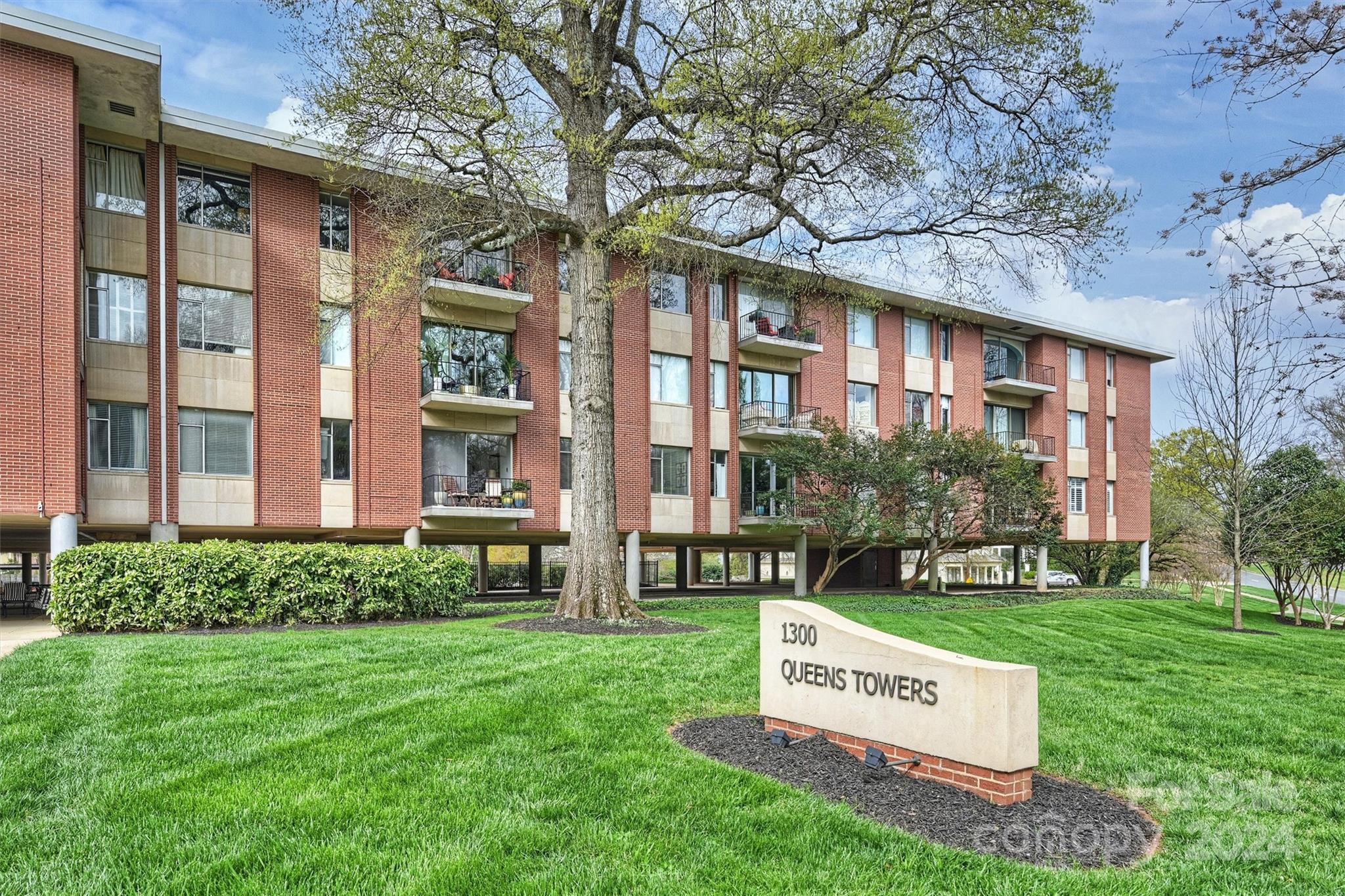1300 Queens Road, Unit 317 Charlotte, NC 28207 - Photo 24 of 24 a sign on the side of a building