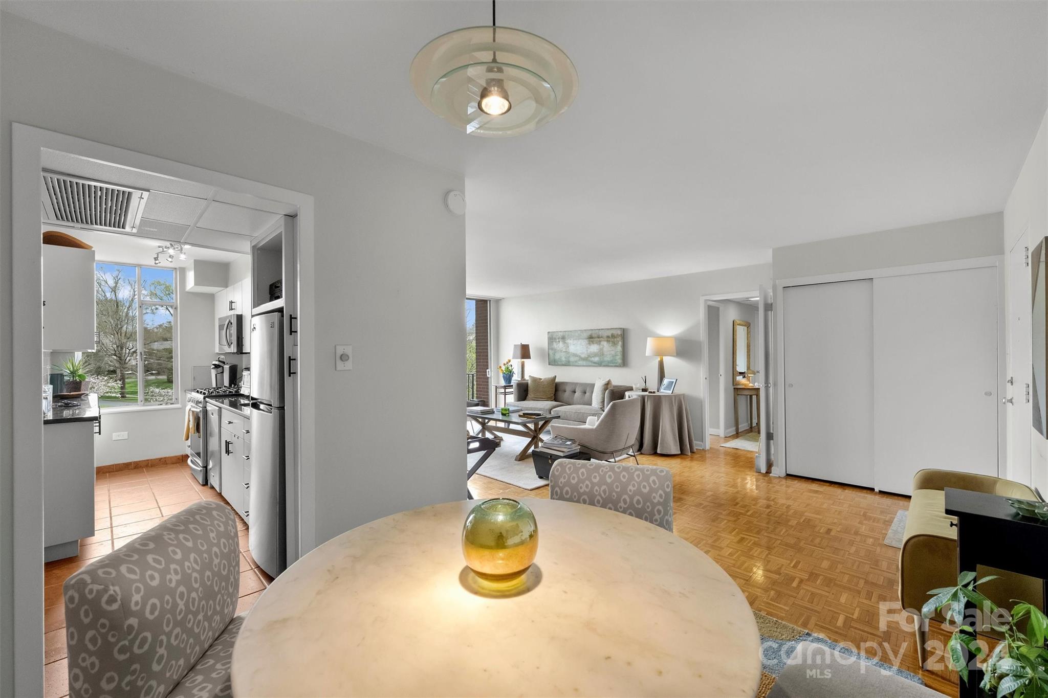 1300 Queens Road, Unit 317 Charlotte, NC 28207 - Photo 6 of 24 a view of a dining room with furniture