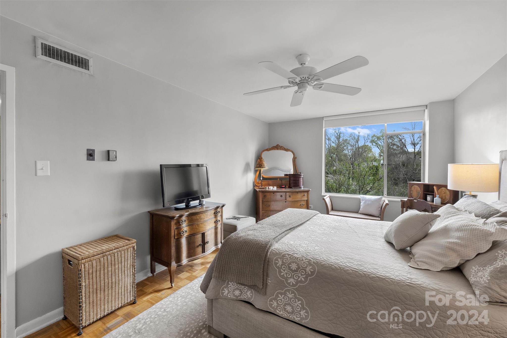 1300 Queens Road, Unit 317 Charlotte, NC 28207 - Photo 10 of 24 a bedroom with a bed a window and a flat screen television