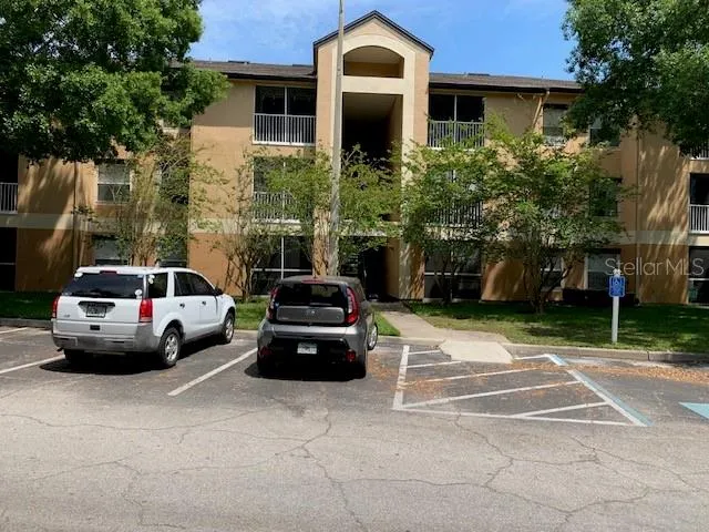 a car parked in front of a brick house