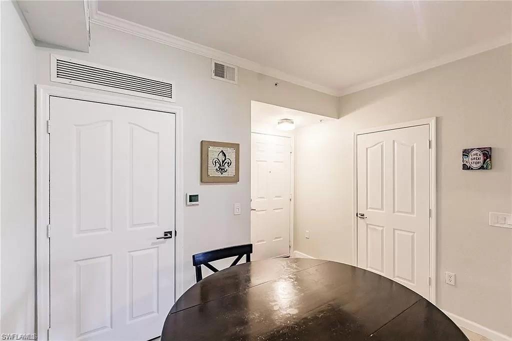 13010 Positano Circle, Unit 101 Naples, FL 34105 - Photo 12 of 29 a view of a livingroom with wooden floor