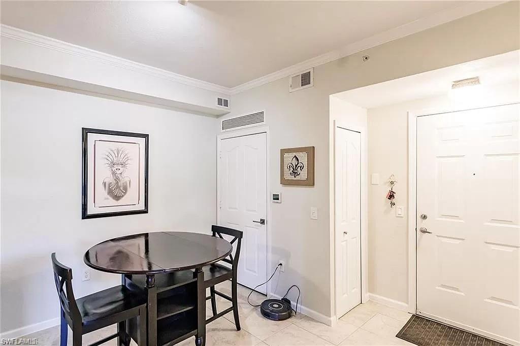 13010 Positano Circle, Unit 101 Naples, FL 34105 - Photo 13 of 29 a view of a livingroom with furniture and a window
