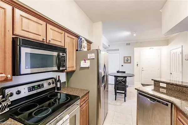 a kitchen with a stove and a microwave