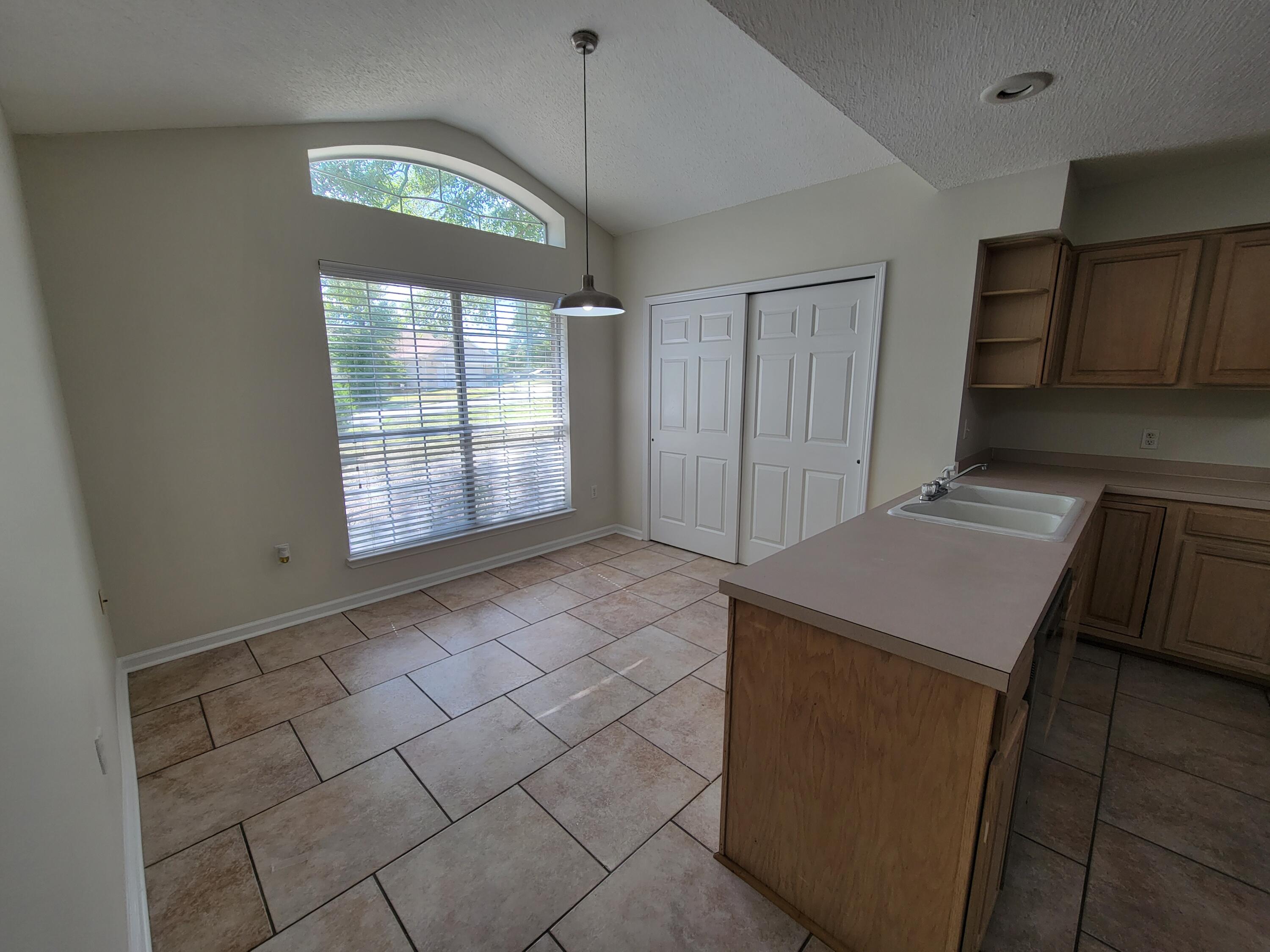 45 Hidden Lakes Trail DeFuniak Springs, FL 32433 - Photo 12 of 39 a view of an empty room with a window