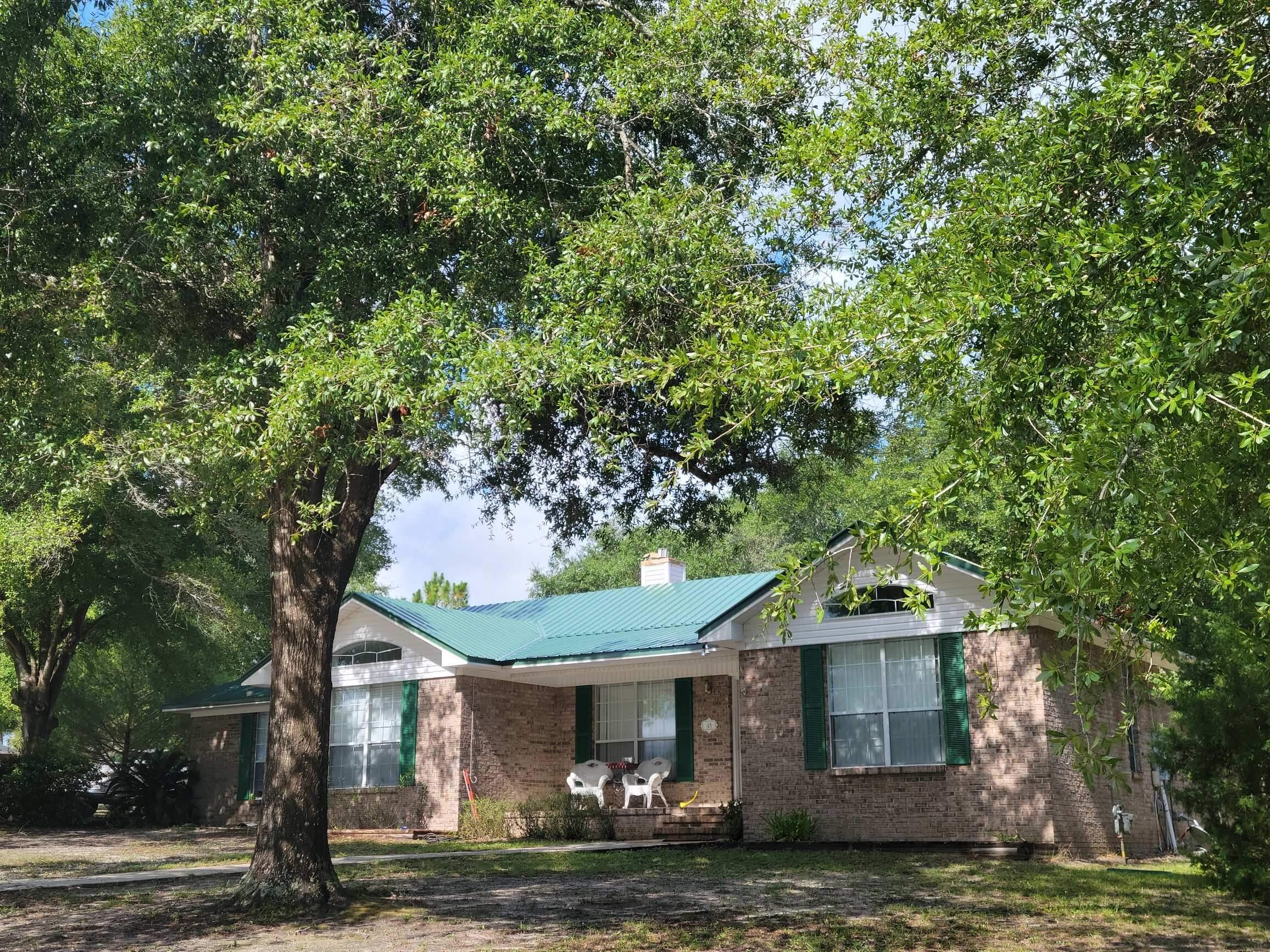 45 Hidden Lakes Trail DeFuniak Springs, FL 32433 - Photo 2 of 39 a front view of a house with garden