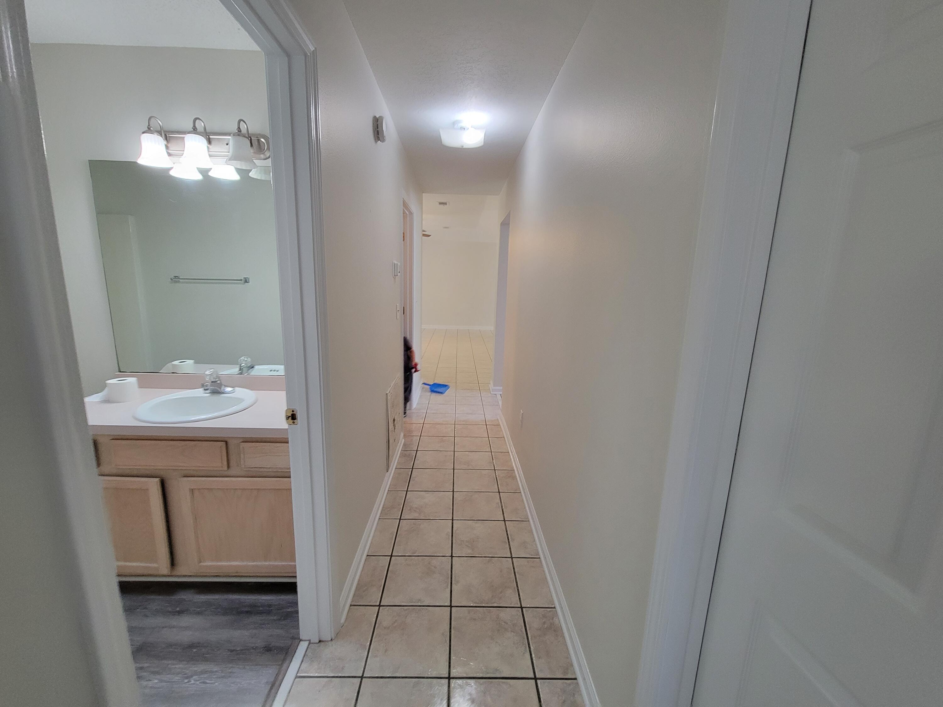 45 Hidden Lakes Trail DeFuniak Springs, FL 32433 - Photo 27 of 39 a bathroom with a sink and mirror