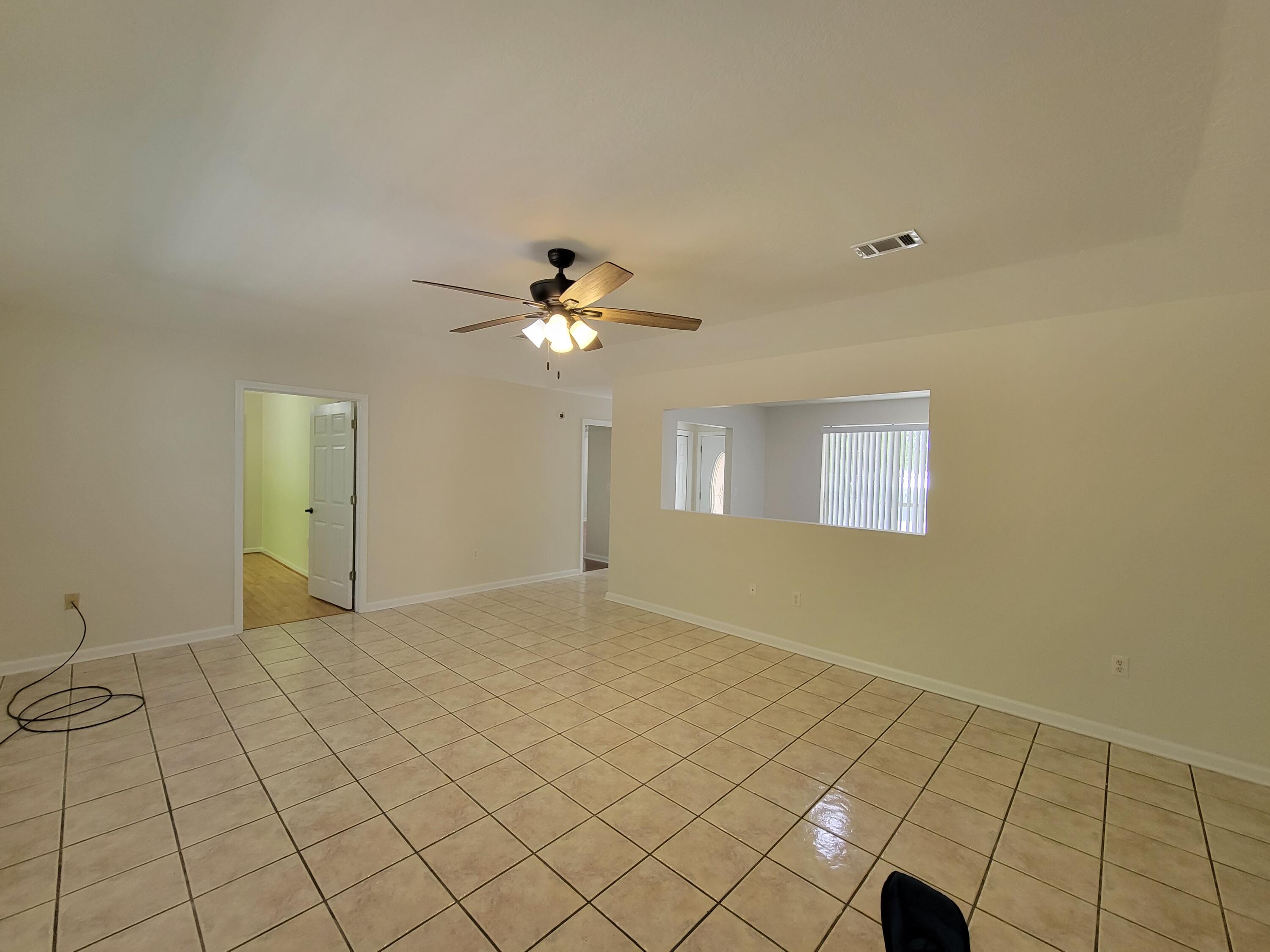 45 Hidden Lakes Trail DeFuniak Springs, FL 32433 - Photo 7 of 39 a view of an empty room