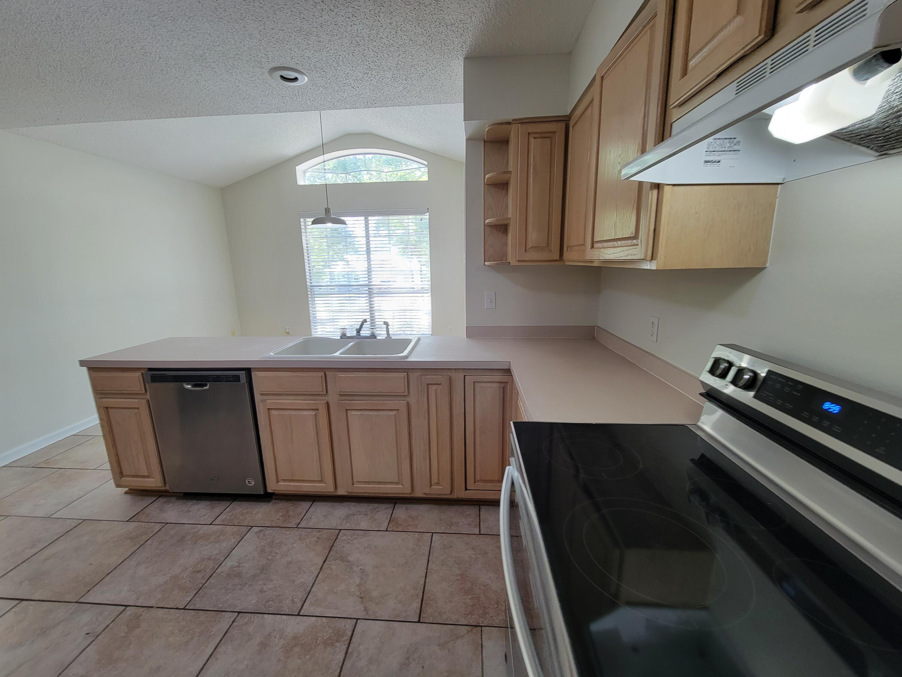 45 Hidden Lakes Trail DeFuniak Springs, FL 32433 - Photo 10 of 39 a kitchen with a cabinets and window