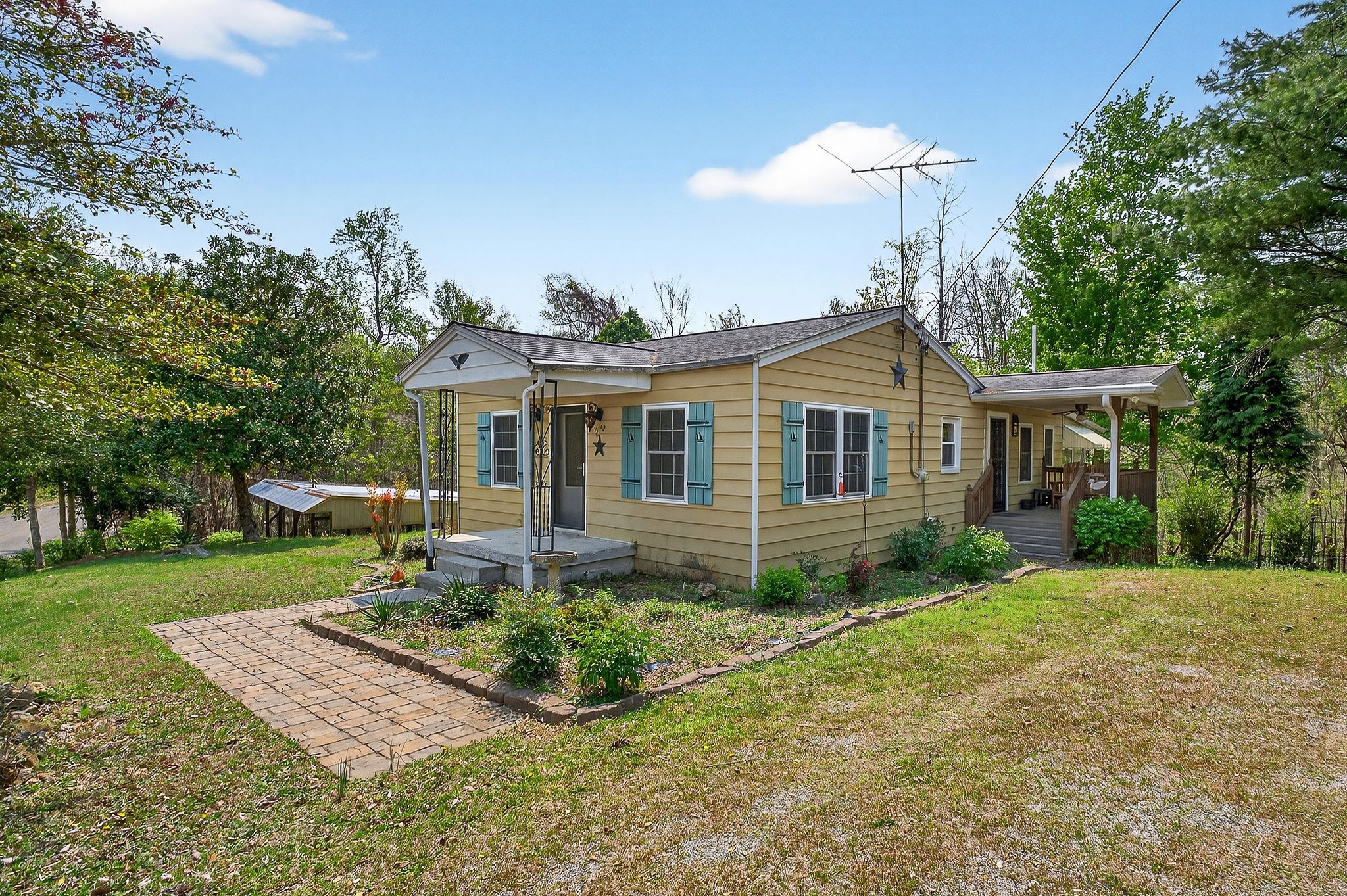 1932 Holly Creek Road Celina, TN 38551 - Photo 1 of 31 front view of a house with a yard