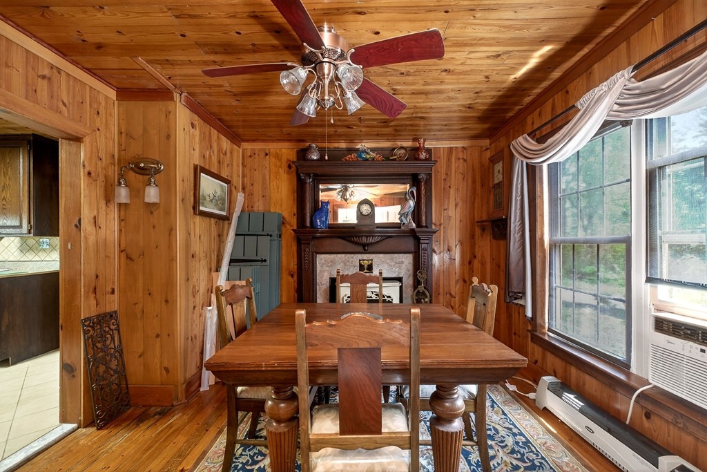 1932 Holly Creek Road Celina, TN 38551 - Photo 12 of 31 a dining room with furniture a chandelier and wooden floor