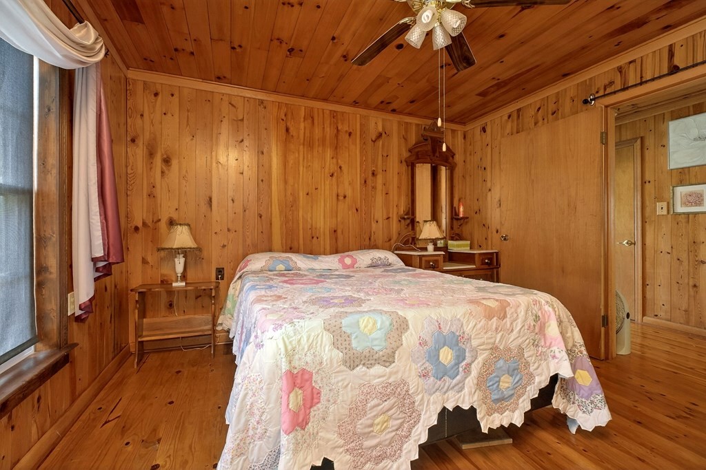 1932 Holly Creek Road Celina, TN 38551 - Photo 15 of 31 a bedroom with a bed and a mirror