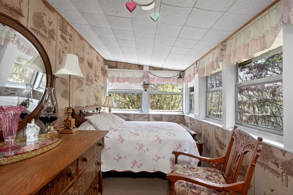 1932 Holly Creek Road Celina, TN 38551 - Photo 17 of 31 a bed room with a bed and a chair