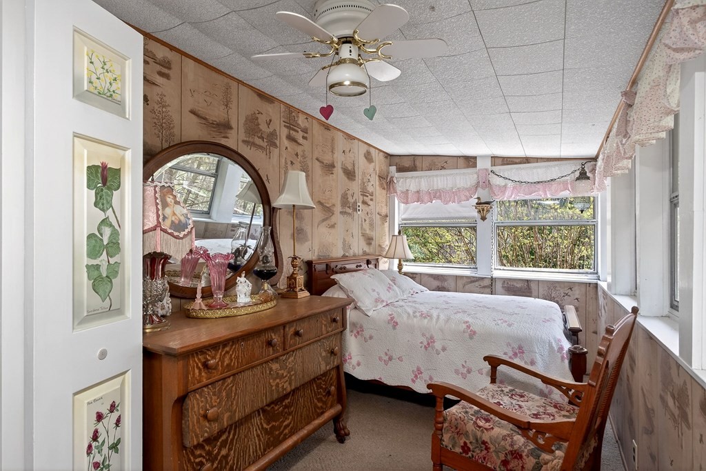 1932 Holly Creek Road Celina, TN 38551 - Photo 18 of 31 a bed room with a bed and a large window
