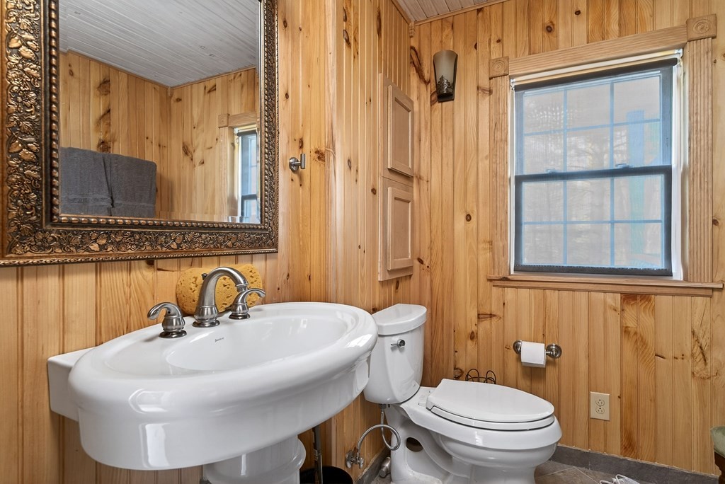 1932 Holly Creek Road Celina, TN 38551 - Photo 21 of 31 a bathroom with a sink a toilet and shower