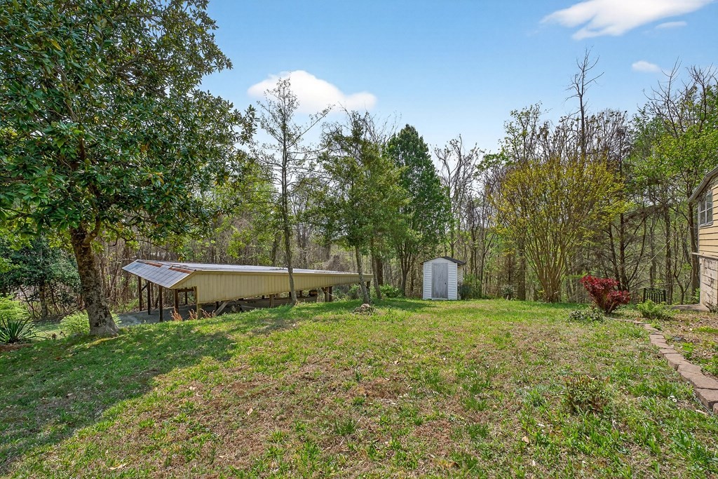 1932 Holly Creek Road Celina, TN 38551 - Photo 29 of 31 a view of a chair and table in the yard