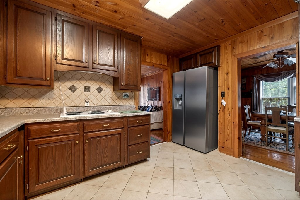 1932 Holly Creek Road Celina, TN 38551 - Photo 6 of 31 a kitchen with granite countertop stainless steel appliances a refrigerator and sink