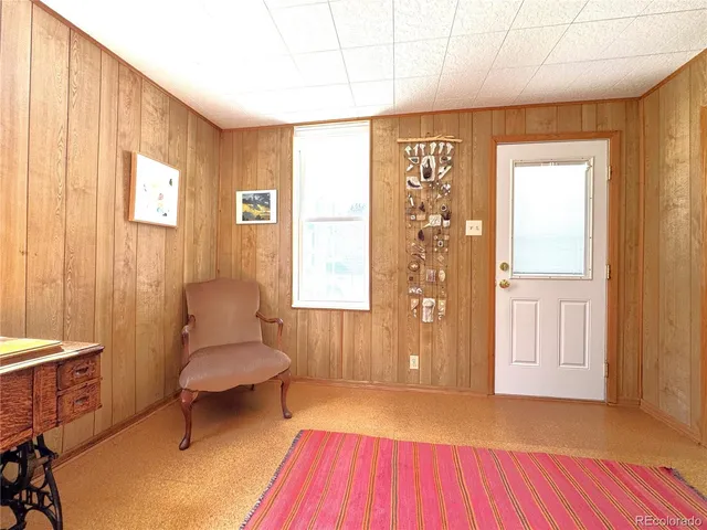 a spacious bedroom with a bed and a window