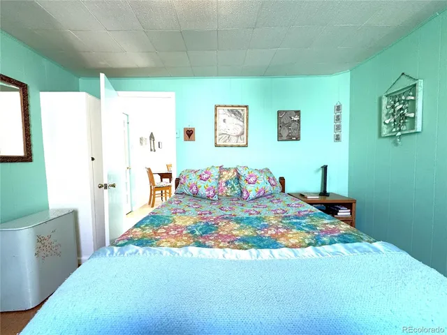 a bedroom with a bed and a table in it