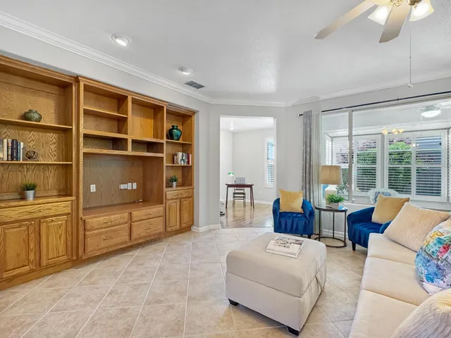 a living room with furniture and walk in closet