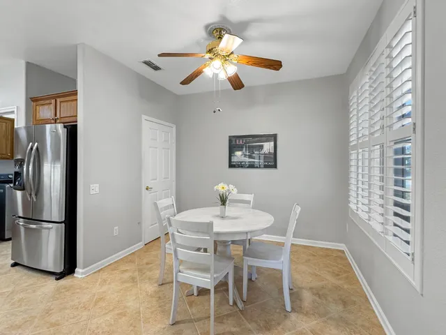 a dining room with furniture and window