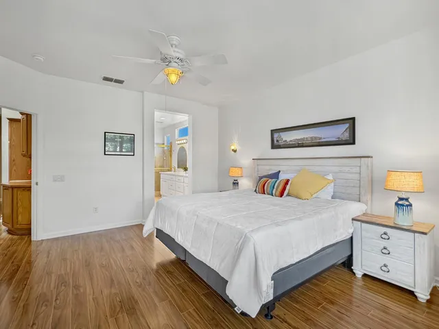 a bedroom with a bed and a dresser