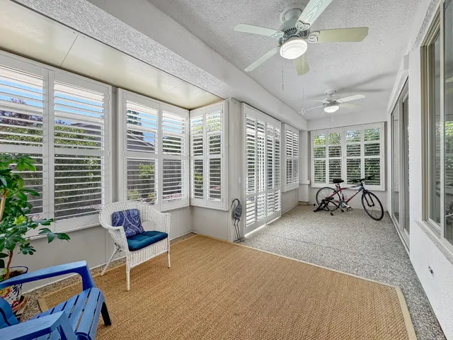 a livingroom with furniture and a large window