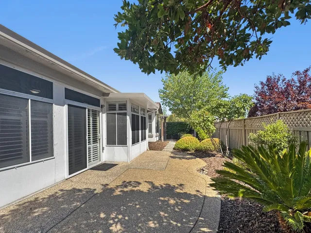 a view of a house with a tree in the background